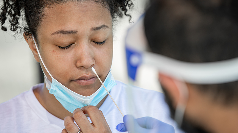 a girl gets her nose swabbed